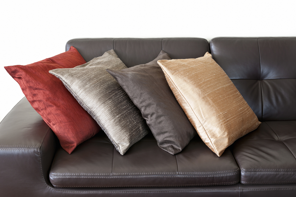 How Do You Decorate A Sofa With Throws?